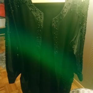 Black jacket. Long with black beads and croushed shoulders.